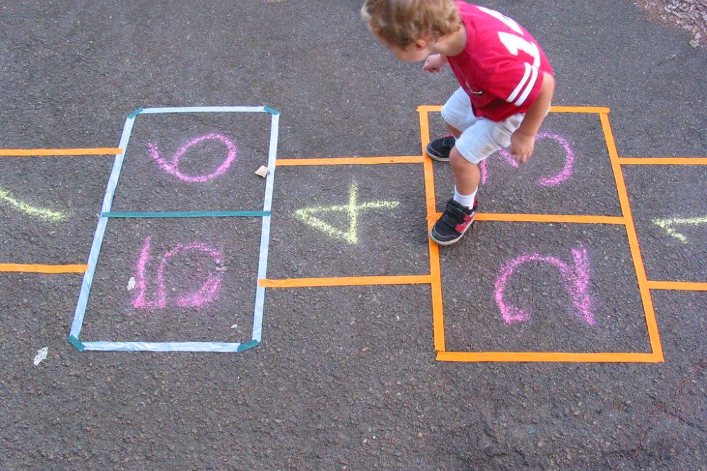 Lucas learns the ancient game of hopscotch. | Although techn… | Flickr
