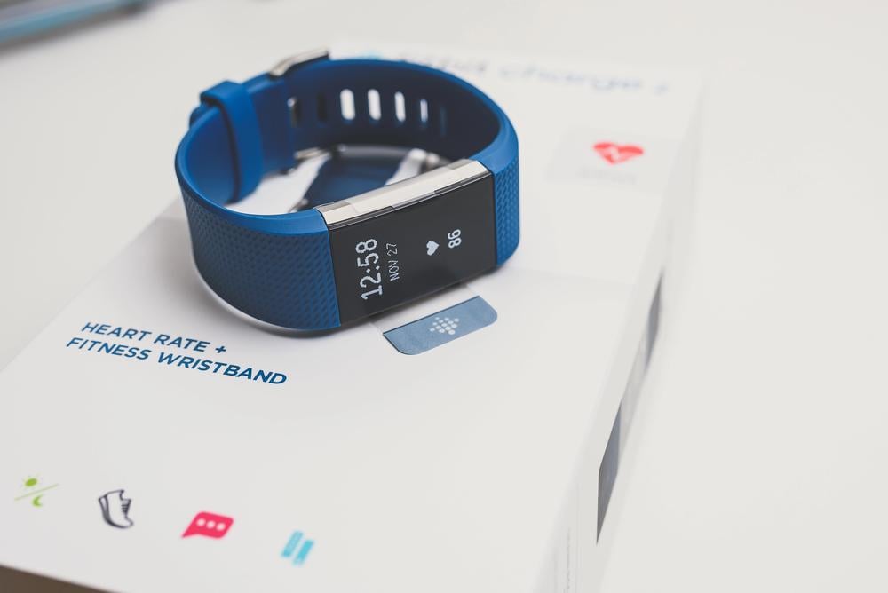 KAUNAS, LITHUANIA - JANUARY 25, 2018: Unboxing Fitbit Charge 2. This ia heart rate and fitness wristband that tracks activity. — Photo by Afotoeu