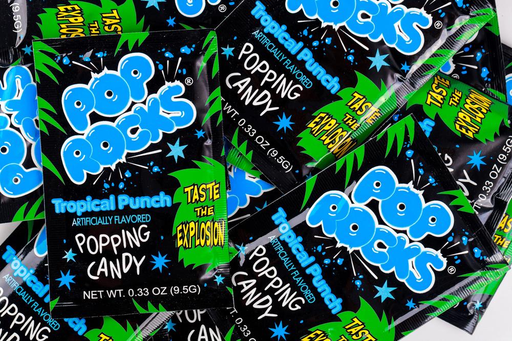 May 4, 2021. New York, US. Sour popping candy Pop Rocks tropical punch on white background. — Photo by tastyfood