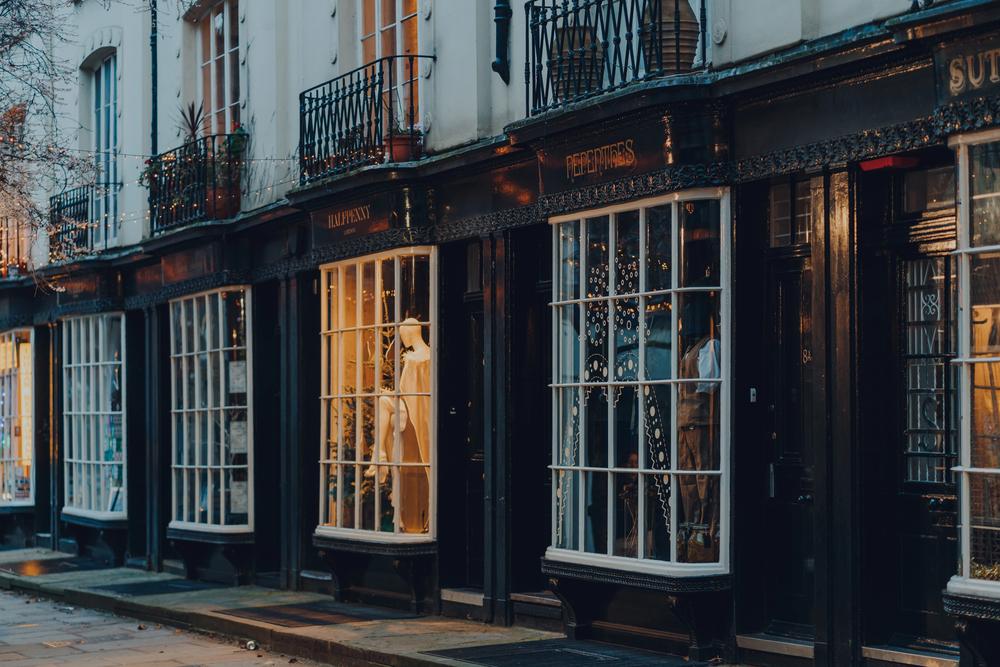 London, UK - January 01, 2022: Row of shops on a street in Bloomsbury, an area of London famous for the British Museum, tree-lined squares and Georgian townhouses, selective focus. — Photo by AlenaKr